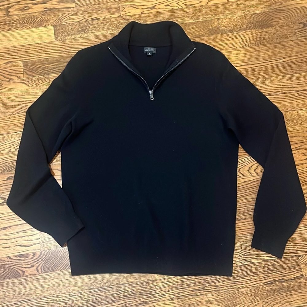 J Crew Men’s black quarter zip sweater.